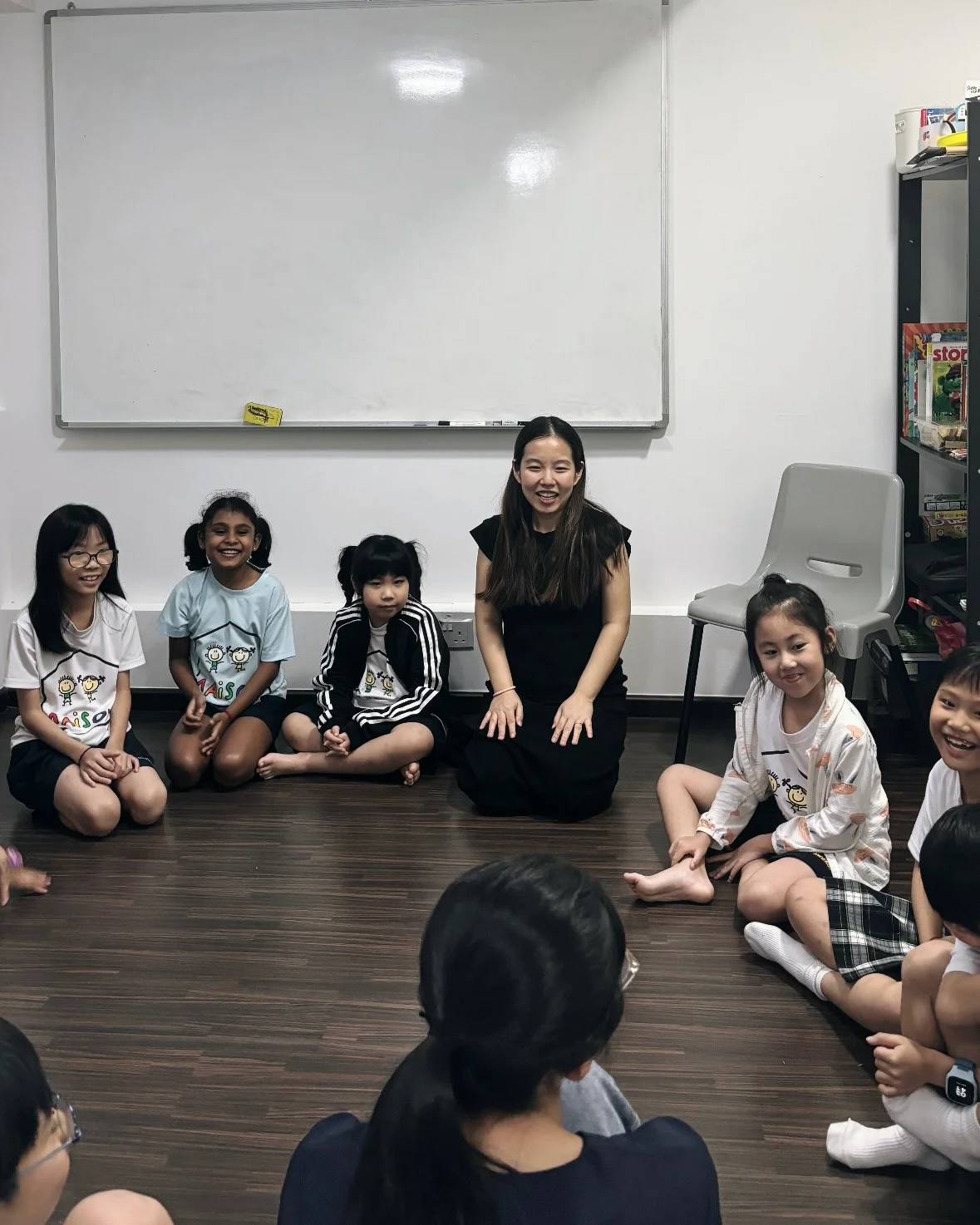 Kalinda Teo conducting a sharing session with children about oral health.
