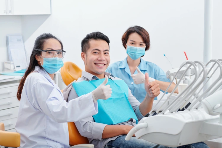 Male patient satisfied with his visit to the dentist for his dental treatment.